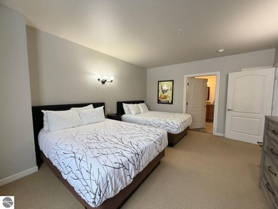 Enjoy views of the 18th hole and pond at the Lodge at Cedar on Schuss Mountain Golf Club in Michigan - for sale on GolfHomes.com, golf home, golf lot