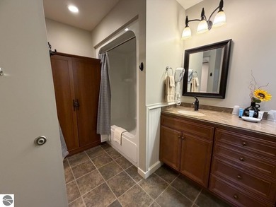 Enjoy views of the 18th hole and pond at the Lodge at Cedar on Schuss Mountain Golf Club in Michigan - for sale on GolfHomes.com, golf home, golf lot