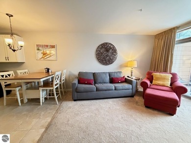 Enjoy views of the 18th hole and pond at the Lodge at Cedar on Schuss Mountain Golf Club in Michigan - for sale on GolfHomes.com, golf home, golf lot