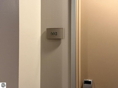 Enjoy views of the 18th hole and pond at the Lodge at Cedar on Schuss Mountain Golf Club in Michigan - for sale on GolfHomes.com, golf home, golf lot