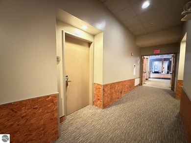 Enjoy views of the 18th hole and pond at the Lodge at Cedar on Schuss Mountain Golf Club in Michigan - for sale on GolfHomes.com, golf home, golf lot