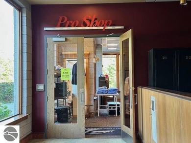 Enjoy views of the 18th hole and pond at the Lodge at Cedar on Schuss Mountain Golf Club in Michigan - for sale on GolfHomes.com, golf home, golf lot