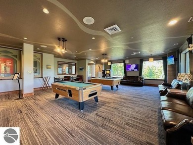 Enjoy views of the 18th hole and pond at the Lodge at Cedar on Schuss Mountain Golf Club in Michigan - for sale on GolfHomes.com, golf home, golf lot