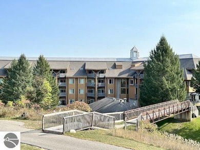 Enjoy views of the 18th hole and pond at the Lodge at Cedar on Schuss Mountain Golf Club in Michigan - for sale on GolfHomes.com, golf home, golf lot