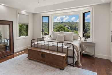 Wake up to the sun-drenched beauty of the Blue Ridge Mountains on Wildcat Cliffs Country Club in North Carolina - for sale on GolfHomes.com, golf home, golf lot