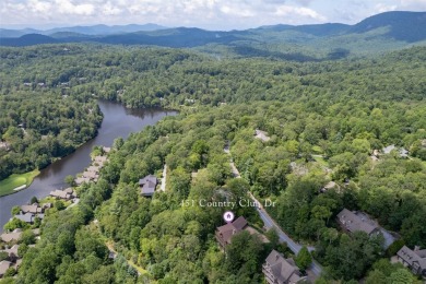 Wake up to the sun-drenched beauty of the Blue Ridge Mountains on Wildcat Cliffs Country Club in North Carolina - for sale on GolfHomes.com, golf home, golf lot