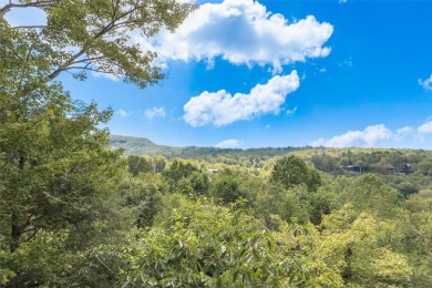 Wake up to the sun-drenched beauty of the Blue Ridge Mountains on Wildcat Cliffs Country Club in North Carolina - for sale on GolfHomes.com, golf home, golf lot
