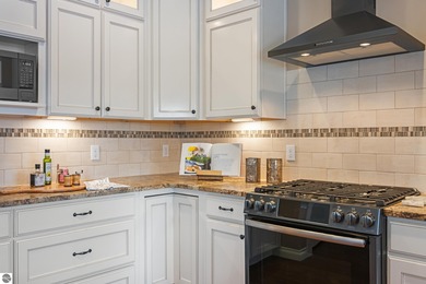 Golf course living o Just off the 11th fairway of The Bear o on Grand Traverse Resort and Spa in Michigan - for sale on GolfHomes.com, golf home, golf lot