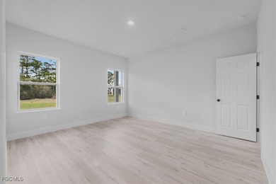 Brand-New Home on Oversized .65-Acre Lot in Sun 'N Lake on Sun n Lake Golf and Country Club in Florida - for sale on GolfHomes.com, golf home, golf lot