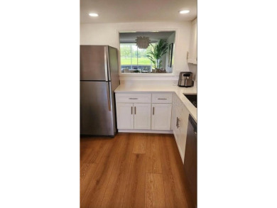 Experience the relaxation of maintenance free living in Palm on Palm Aire Country Club of Sarasota in Florida - for sale on GolfHomes.com, golf home, golf lot