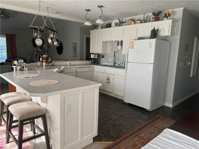 Well cared-for townhouse with maintenance included. One story on Holiday Island Executive Golf Course in Arkansas - for sale on GolfHomes.com, golf home, golf lot
