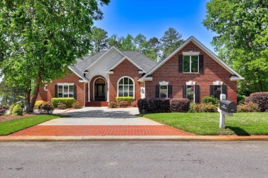 Stately home with stunning views overlooking Spalding Lake on Woodside Plantation Country Club in South Carolina - for sale on GolfHomes.com, golf home, golf lot
