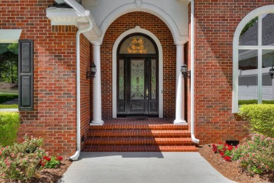 Stately home with stunning views overlooking Spalding Lake on Woodside Plantation Country Club in South Carolina - for sale on GolfHomes.com, golf home, golf lot