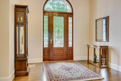Stately home with stunning views overlooking Spalding Lake on Woodside Plantation Country Club in South Carolina - for sale on GolfHomes.com, golf home, golf lot