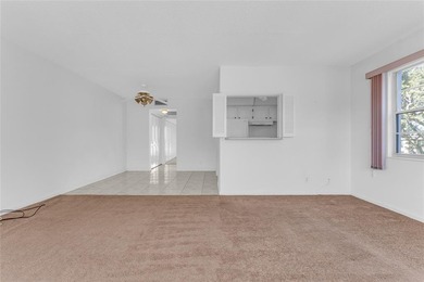 Enjoy peaceful living in this spacious 1-bedroom, 1.5-bath on Hillsboro Pines Golf in Florida - for sale on GolfHomes.com, golf home, golf lot