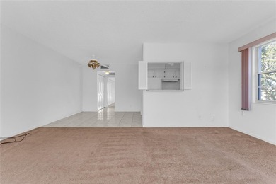 Enjoy peaceful living in this spacious 1-bedroom, 1.5-bath on Hillsboro Pines Golf in Florida - for sale on GolfHomes.com, golf home, golf lot