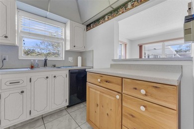 Enjoy peaceful living in this spacious 1-bedroom, 1.5-bath on Hillsboro Pines Golf in Florida - for sale on GolfHomes.com, golf home, golf lot