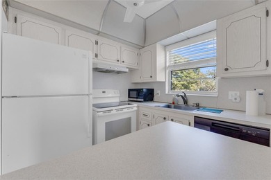 Enjoy peaceful living in this spacious 1-bedroom, 1.5-bath on Hillsboro Pines Golf in Florida - for sale on GolfHomes.com, golf home, golf lot