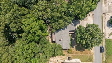 Two fireplaces, two living areas, and tons of bonus space--this on Bella Vista Country Club - Scottsdale in Arkansas - for sale on GolfHomes.com, golf home, golf lot