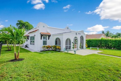 Step into this 1927 West Palm Beach treasure, meticulously on West Palm Beach Golf Course in Florida - for sale on GolfHomes.com, golf home, golf lot