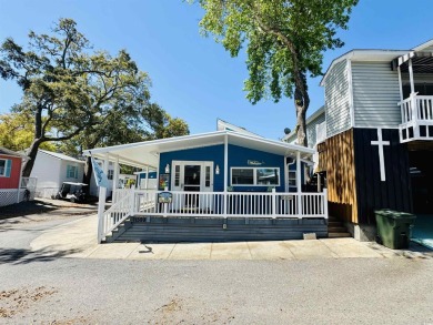 2 BED/2 BATH BEACH HOUSE IN OCEAN LAKES WITH WRAPAROUND COVERED on Prestwick Country Club in South Carolina - for sale on GolfHomes.com, golf home, golf lot