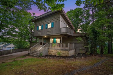 Wake up to stunning water views and a lush, private landscape in on Diamondhead Golf and Country Club in Arkansas - for sale on GolfHomes.com, golf home, golf lot