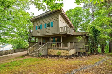 Wake up to stunning water views and a lush, private landscape in on Diamondhead Golf and Country Club in Arkansas - for sale on GolfHomes.com, golf home, golf lot