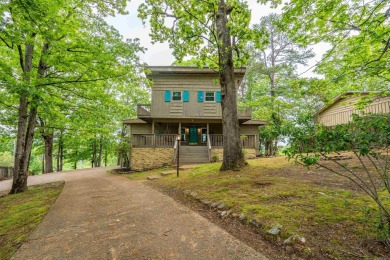 Wake up to stunning water views and a lush, private landscape in on Diamondhead Golf and Country Club in Arkansas - for sale on GolfHomes.com, golf home, golf lot