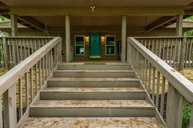 Wake up to stunning water views and a lush, private landscape in on Diamondhead Golf and Country Club in Arkansas - for sale on GolfHomes.com, golf home, golf lot