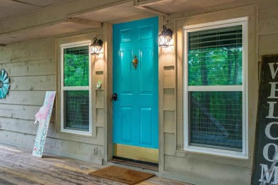 Wake up to stunning water views and a lush, private landscape in on Diamondhead Golf and Country Club in Arkansas - for sale on GolfHomes.com, golf home, golf lot