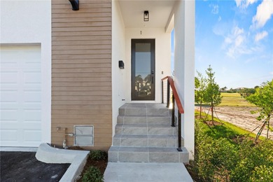 Experience contemporary living in this BRAND-NEW 2025 two-story on Saint Andrews South Golf Club in Florida - for sale on GolfHomes.com, golf home, golf lot