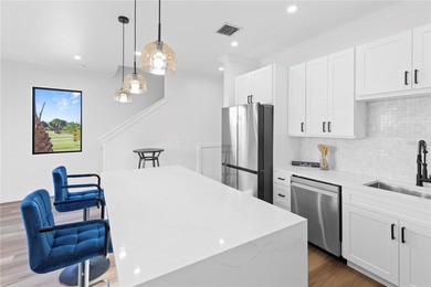 Experience contemporary living in this BRAND-NEW 2025 two-story on Saint Andrews South Golf Club in Florida - for sale on GolfHomes.com, golf home, golf lot