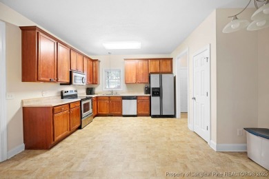 Step inside this charming 3-bedroom, 2-bath home featuring a on Carolina Lakes Country Club in North Carolina - for sale on GolfHomes.com, golf home, golf lot