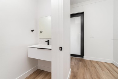 Experience contemporary living in this BRAND-NEW 2025 two-story on Saint Andrews South Golf Club in Florida - for sale on GolfHomes.com, golf home, golf lot