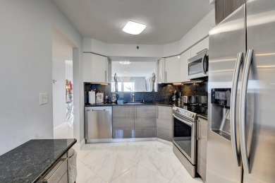 Beautiful corner unit, completely renovated, impact windows 3/8 on Marina Lakes Golf Course in Florida - for sale on GolfHomes.com, golf home, golf lot