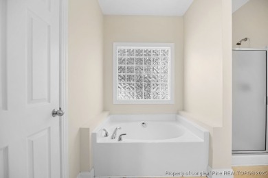 Step inside this charming 3-bedroom, 2-bath home featuring a on Carolina Lakes Country Club in North Carolina - for sale on GolfHomes.com, golf home, golf lot