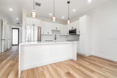 Experience contemporary living in this BRAND-NEW 2025 two-story on Saint Andrews South Golf Club in Florida - for sale on GolfHomes.com, golf home, golf lot