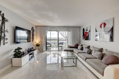 Beautiful corner unit, completely renovated, impact windows 3/8 on Marina Lakes Golf Course in Florida - for sale on GolfHomes.com, golf home, golf lot