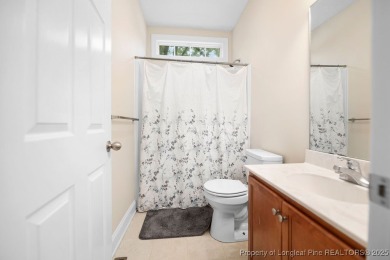 Step inside this charming 3-bedroom, 2-bath home featuring a on Carolina Lakes Country Club in North Carolina - for sale on GolfHomes.com, golf home, golf lot