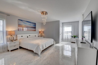 Beautiful corner unit, completely renovated, impact windows 3/8 on Marina Lakes Golf Course in Florida - for sale on GolfHomes.com, golf home, golf lot
