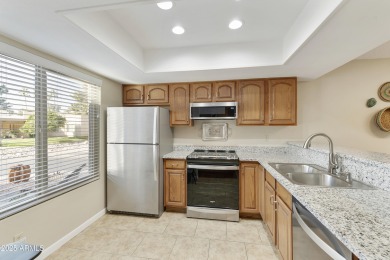 Step into this beautifully updated, move-in-ready end unit in on Fountain of the Sun Country Club in Arizona - for sale on GolfHomes.com, golf home, golf lot