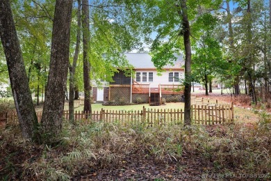 Step inside this charming 3-bedroom, 2-bath home featuring a on Carolina Lakes Country Club in North Carolina - for sale on GolfHomes.com, golf home, golf lot