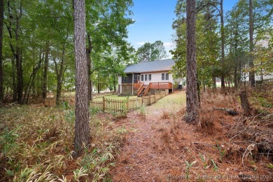Step inside this charming 3-bedroom, 2-bath home featuring a on Carolina Lakes Country Club in North Carolina - for sale on GolfHomes.com, golf home, golf lot