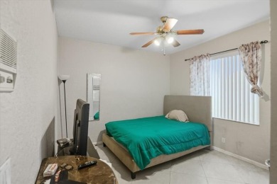 Spacious 3 bed, 3 bath home with private pool located in the on Woodmont Country Club in Florida - for sale on GolfHomes.com, golf home, golf lot