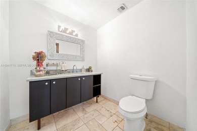 Distinguished luxury estate in South Miami, just 4 minutes from on Briar Bay Golf Course in Florida - for sale on GolfHomes.com, golf home, golf lot