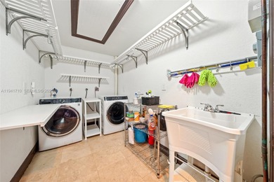 Distinguished luxury estate in South Miami, just 4 minutes from on Briar Bay Golf Course in Florida - for sale on GolfHomes.com, golf home, golf lot