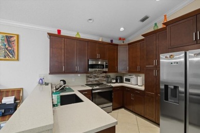 Spacious 3 bed, 3 bath home with private pool located in the on Woodmont Country Club in Florida - for sale on GolfHomes.com, golf home, golf lot