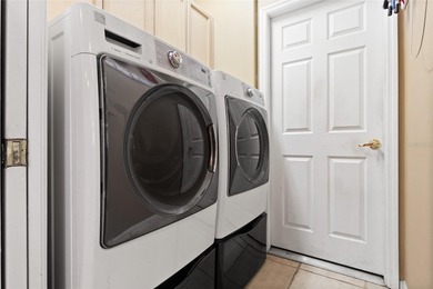 STUNNING Courtyard Home on *PRIVATE CONSERVATION* *With 2 MASTER on The Groves Golf and Country Club in Florida - for sale on GolfHomes.com, golf home, golf lot