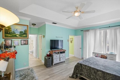 Spacious 3 bed, 3 bath home with private pool located in the on Woodmont Country Club in Florida - for sale on GolfHomes.com, golf home, golf lot