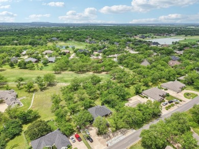 Walk out to the golf course from your large screened in back on Pecan Plantation Country Club in Texas - for sale on GolfHomes.com, golf home, golf lot